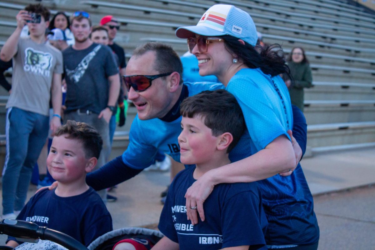 Dr. Weathers taking photos with family after Iron40