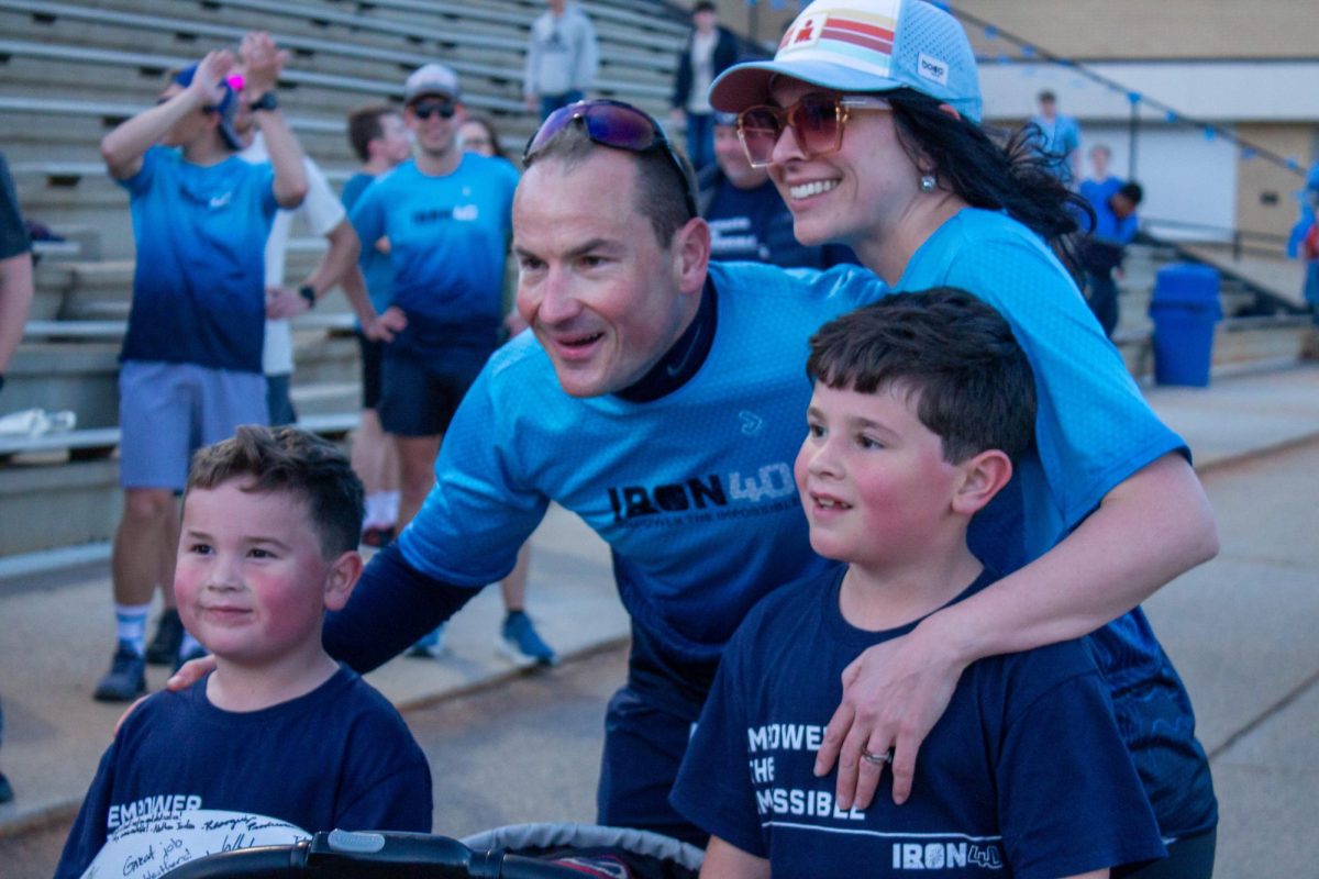 Dr. Weathers taking photos with his family after Iron40