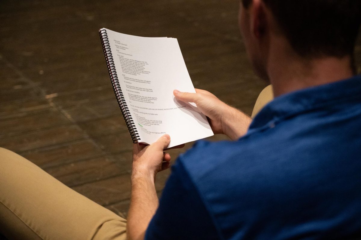 The cast of King Lear reading through the script at Rodeheaver Auditorium.
