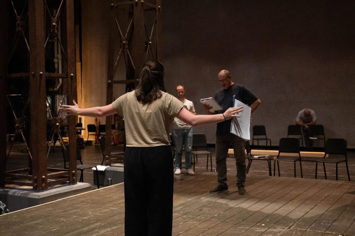 The cast of King Lear reading through the script at Rodeheaver Auditorium.
