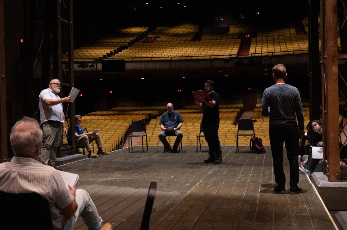 The cast of King Lear reading through the script at Rodeheaver Auditorium.