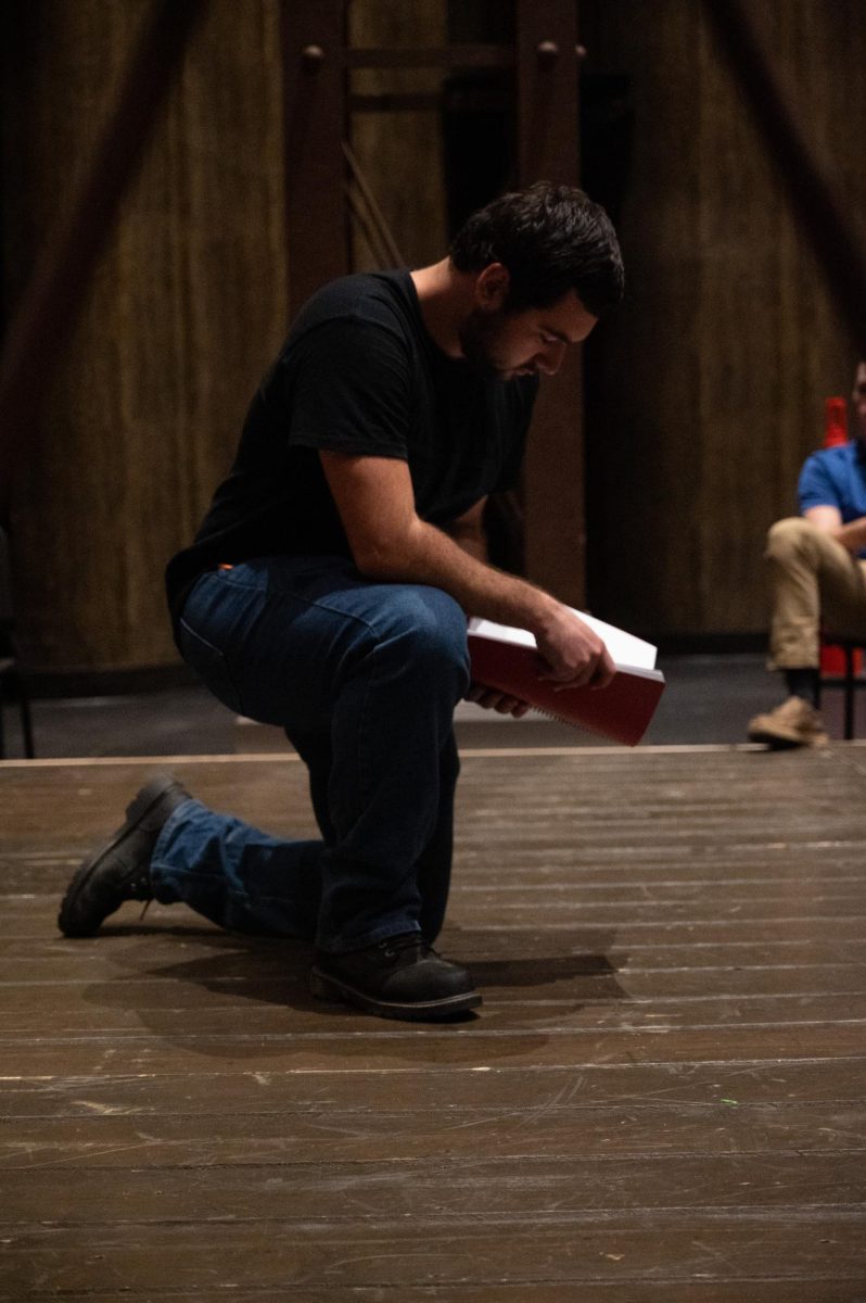 The cast of King Lear reading through the script at Rodeheaver Auditorium.