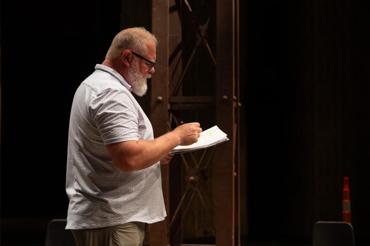 The cast of King Lear reading through the script at Rodeheaver Auditorium.