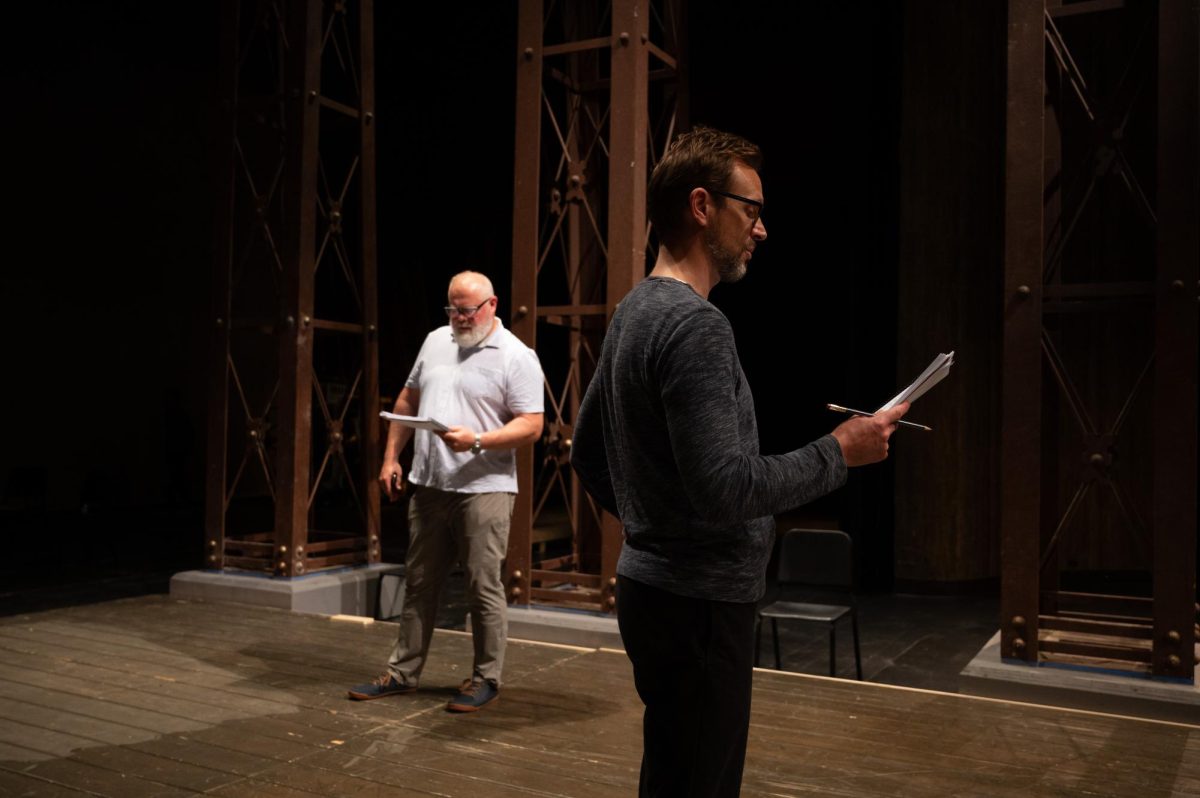 The cast of King Lear reading through the script at Rodeheaver Auditorium.