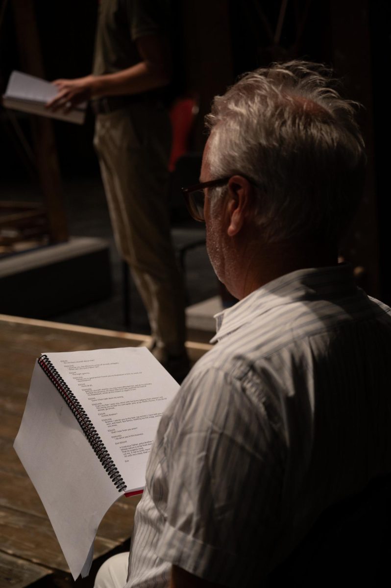 Dr. Stegall watching the cast of King Lear read through the script at Rodeheaver Auditorium.