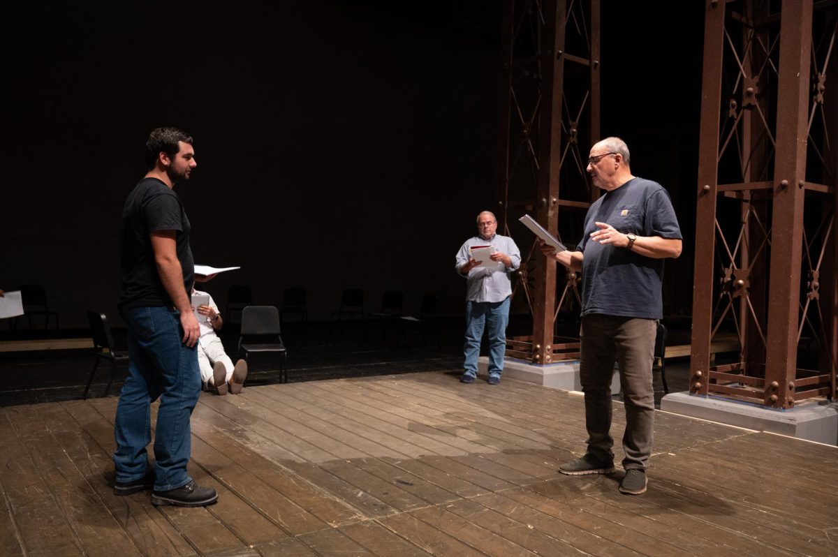 The cast of King Lear reading through the script at Rodeheaver Auditorium.