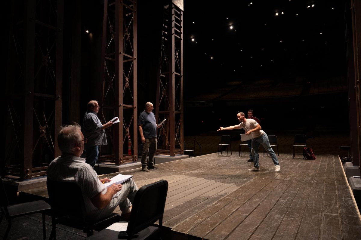 The cast of King Lear reading through the script at Rodeheaver Auditorium.