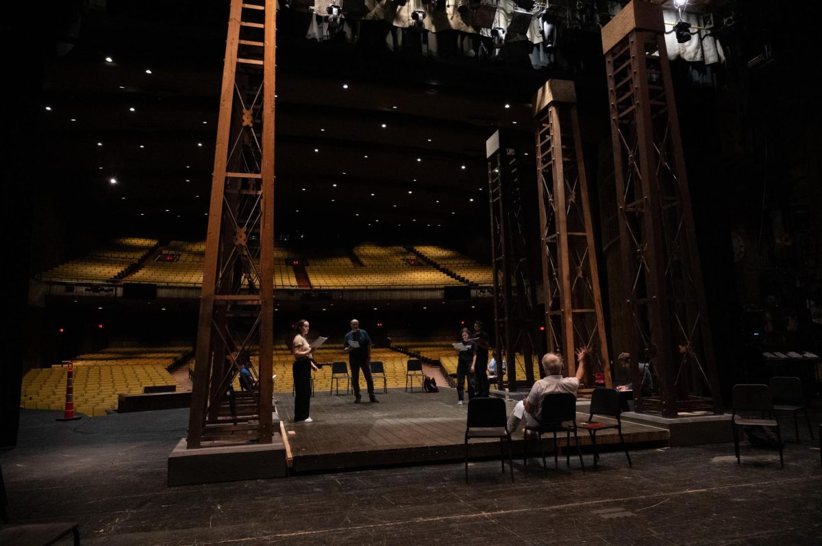 The cast of King Lear reading through the script at Rodeheaver Auditorium.