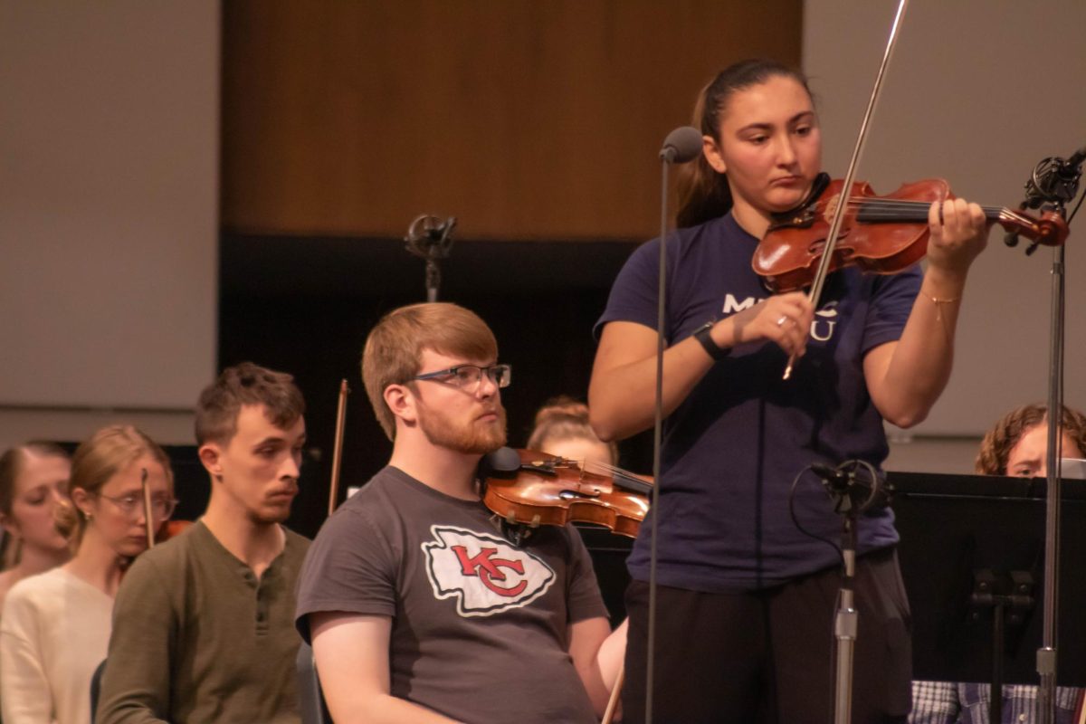 Students rehearsing for Artist Series with David Kim