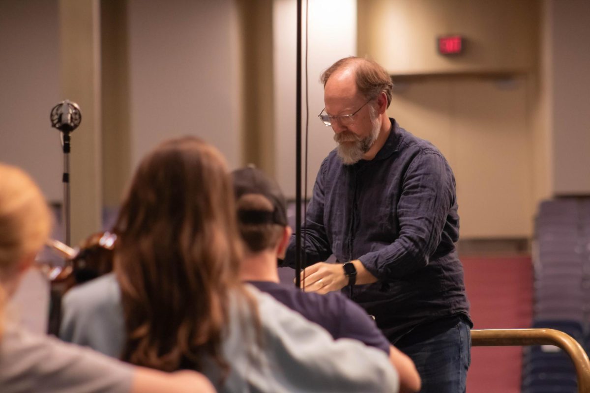 Dr. Moore directing Orchestra during rehearsal for Artist Series with David Kim
