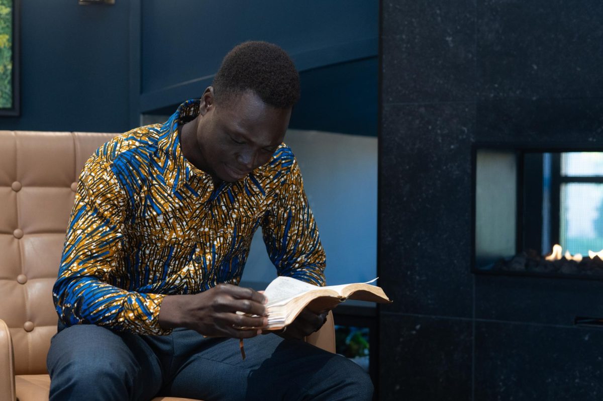 Shadrach Nyeko reading the Bible.