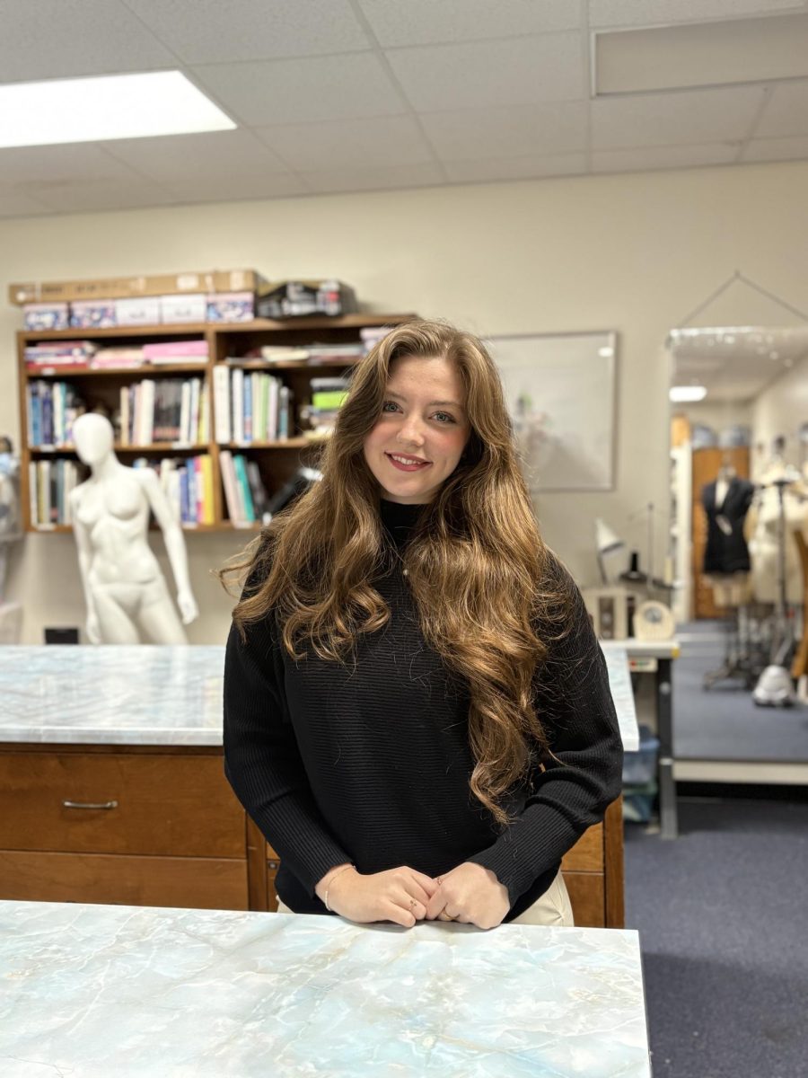 Isabella Marchak stands in an apparel workshop.