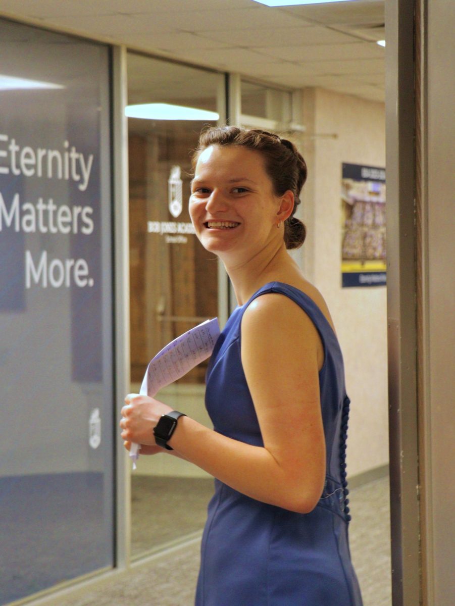 Maddie Smith welcoming guests at Bluejays' Thrift Shop Formal