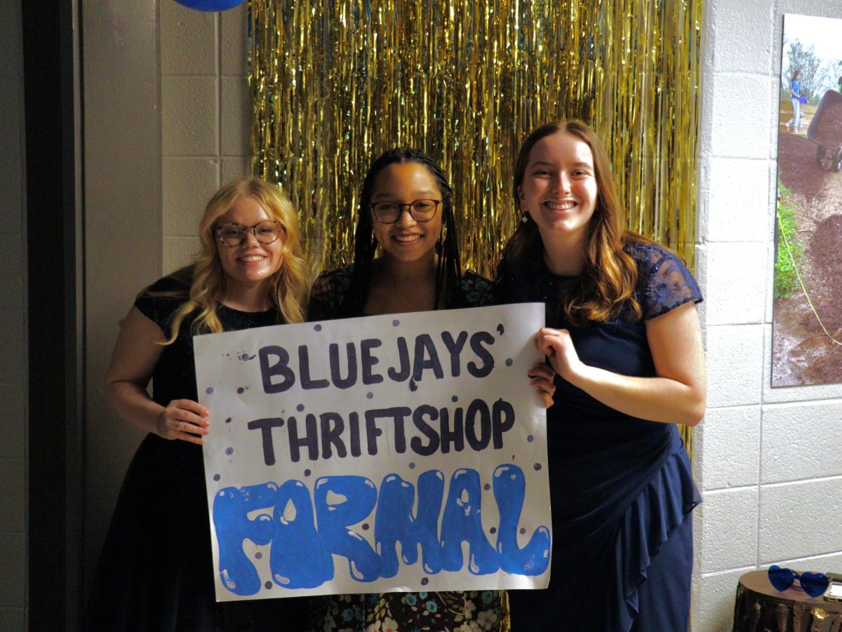 Elaina Willis, Amaris John and Kate Church smiling at Bluejays' Thrift Shop Formal