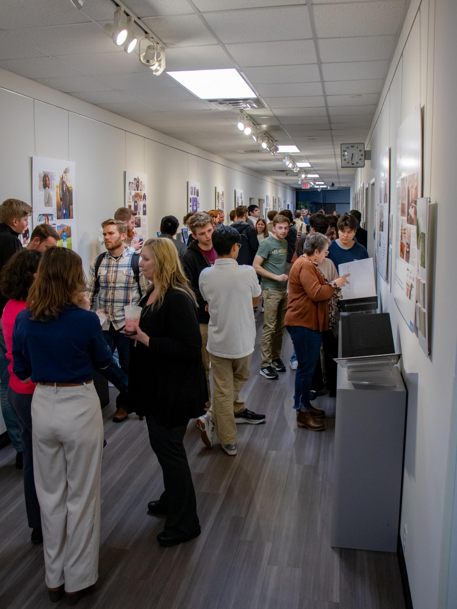Guests view BJU Art and Design's graphic design portfolio presentation