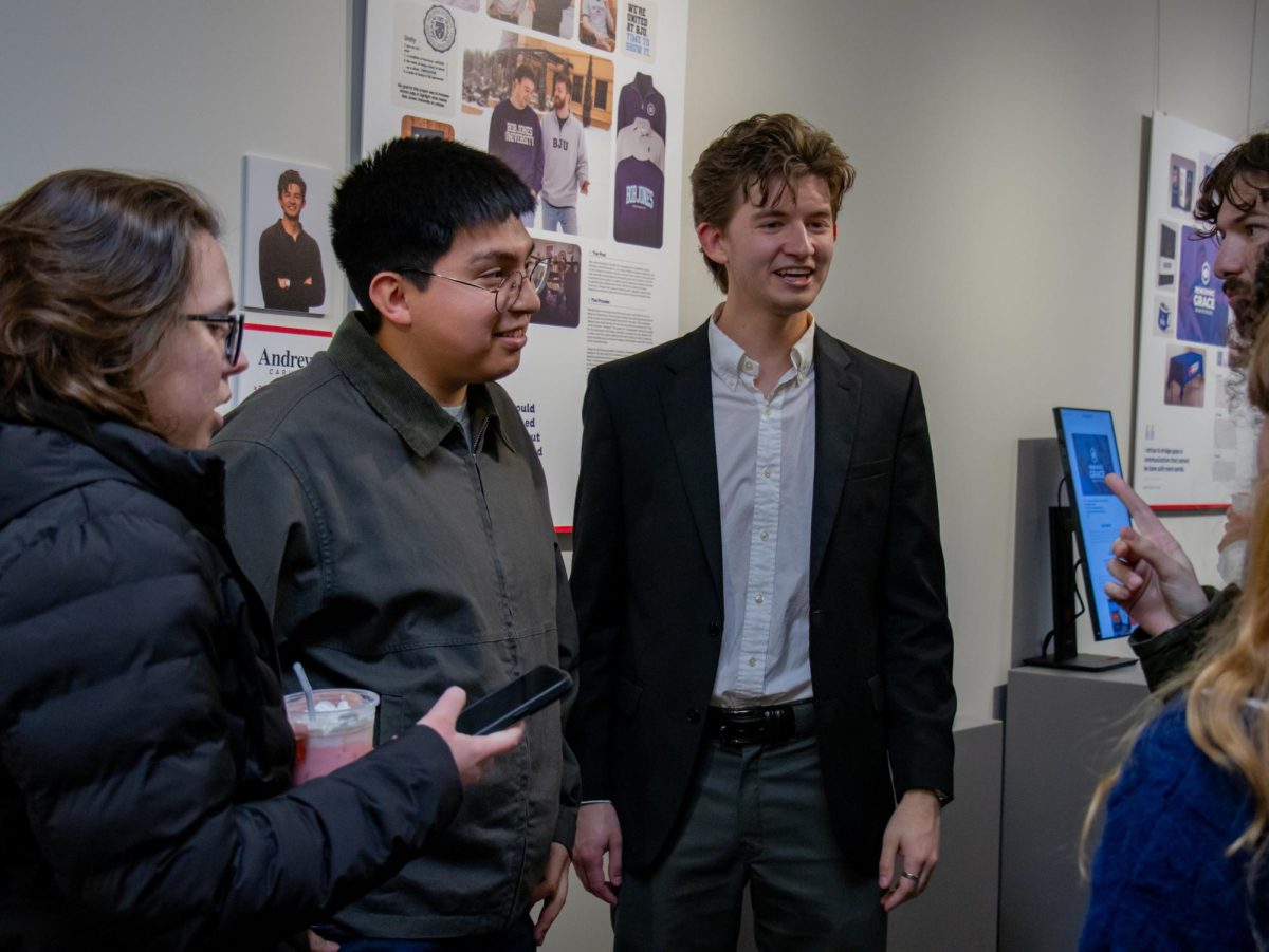 Andrew Carver with guests at his portfolio presentation