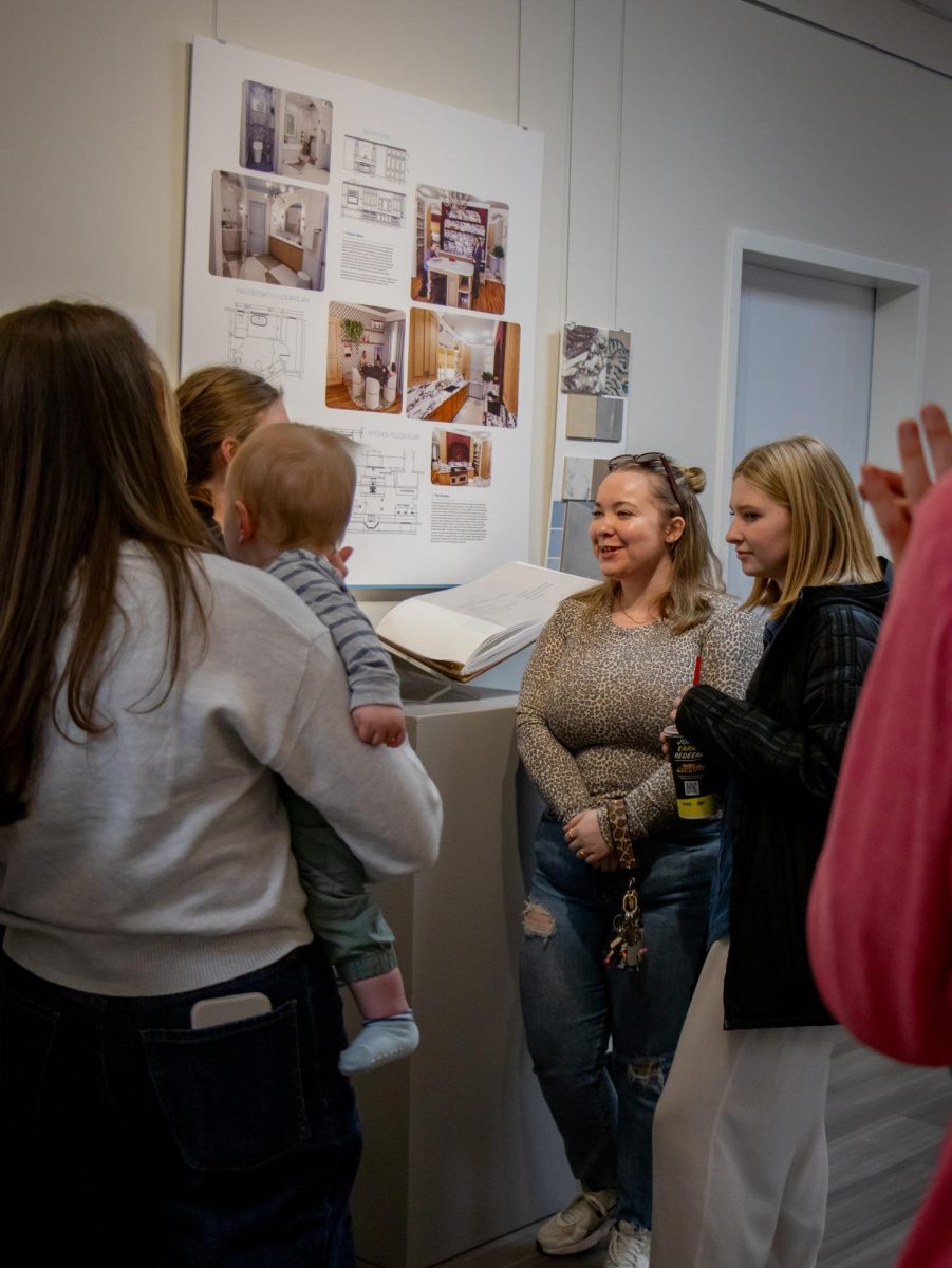 Guests enjoy the graphic design portfolios