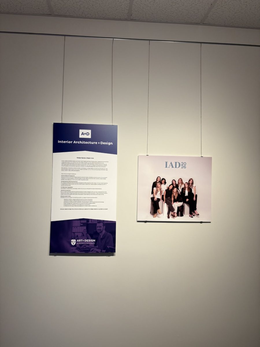 Signs welcome guests to the art and design senior portfolio exhibition for interior architecture and design.