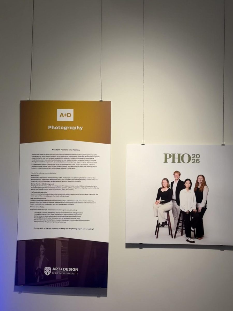 Signs welcome guests to the art and design senior portfolio exhibition for photography.